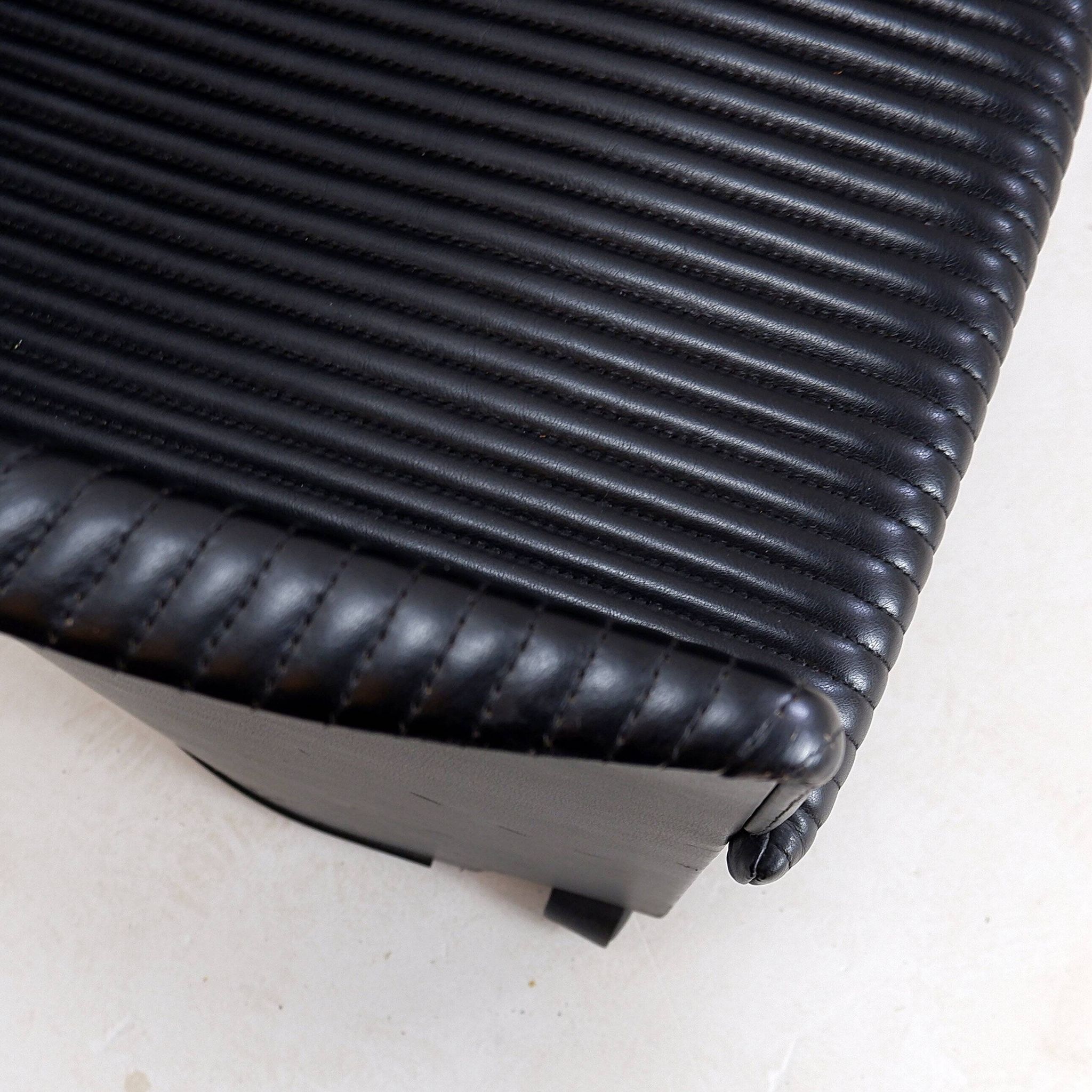 Pair of Artona armchairs in black leather by Afra and Tobia Scarpa for Maxalto.