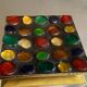 Square section cut glass and metal decorated with multicolored glass cabochons