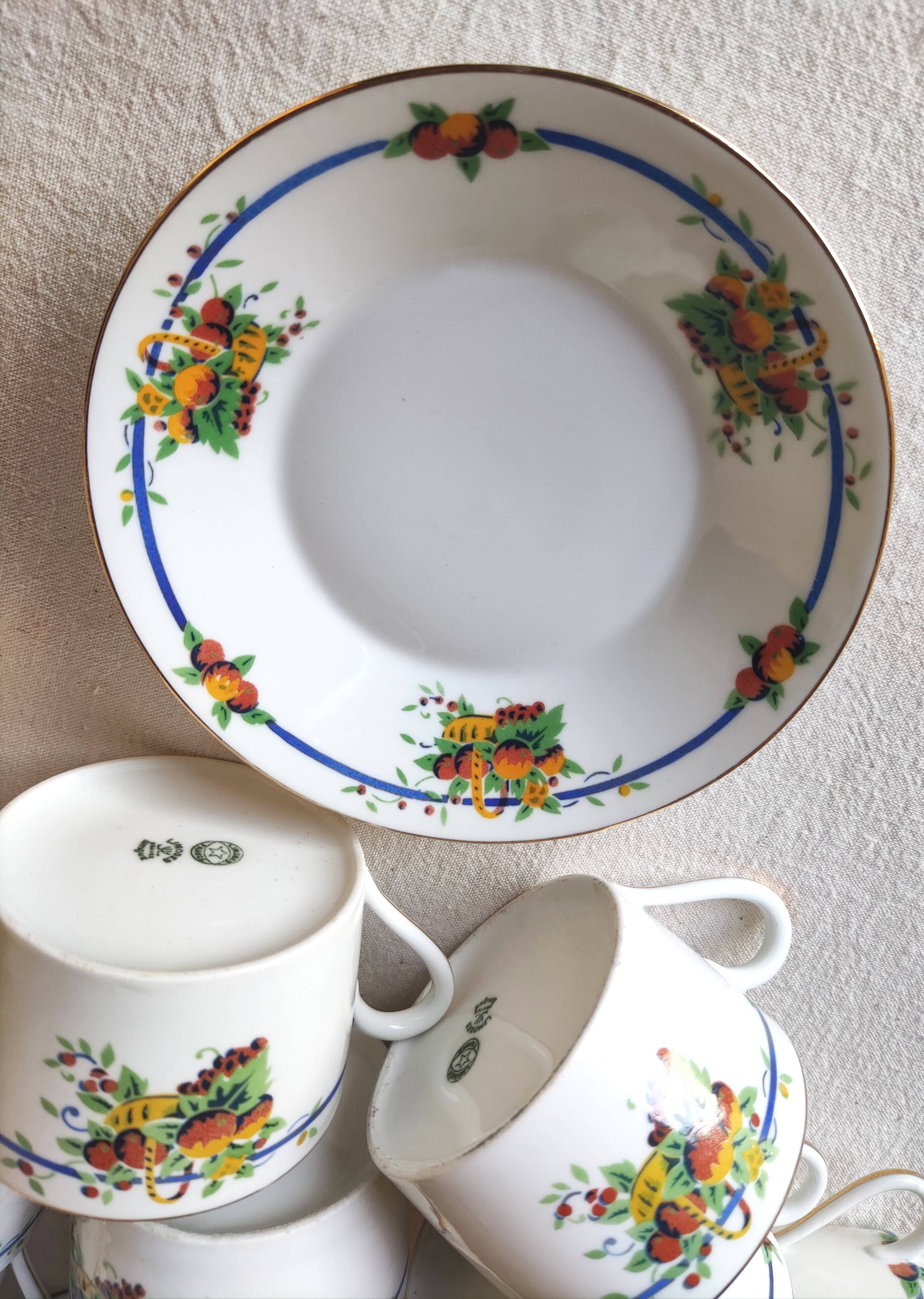 10 tea cups and creamer in Limoges porcelain