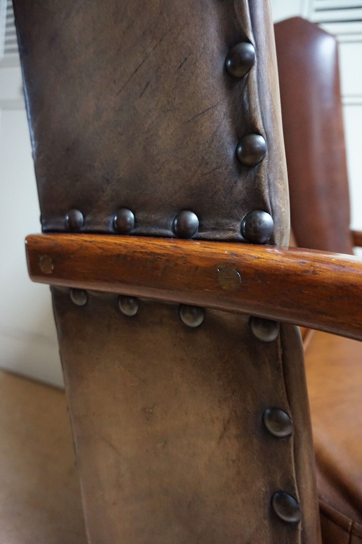 English high back cognac leather wingchair by Criterion cord