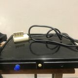 Black bakelite dial telephone with support