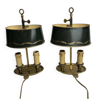 A pair of old brass bed warmers.