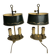 A pair of old brass bed warmers.