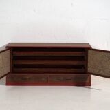 Small Japanese cabinet with sliding doors, Kabuki decoration, made of paulownia wood, early Showa period, circa 1926–1970.