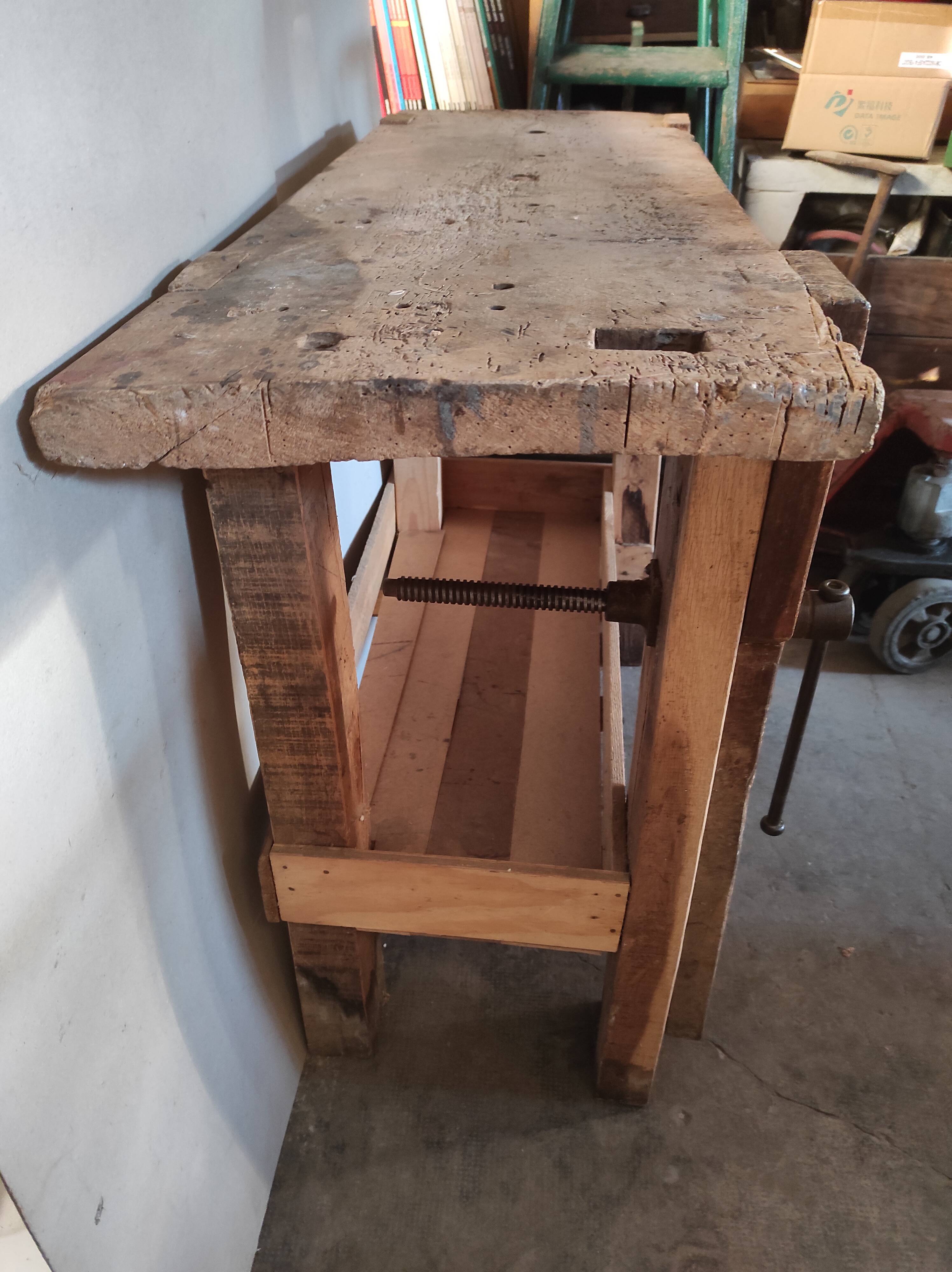 Old homemade vintage solid wood workbench with press and drawer