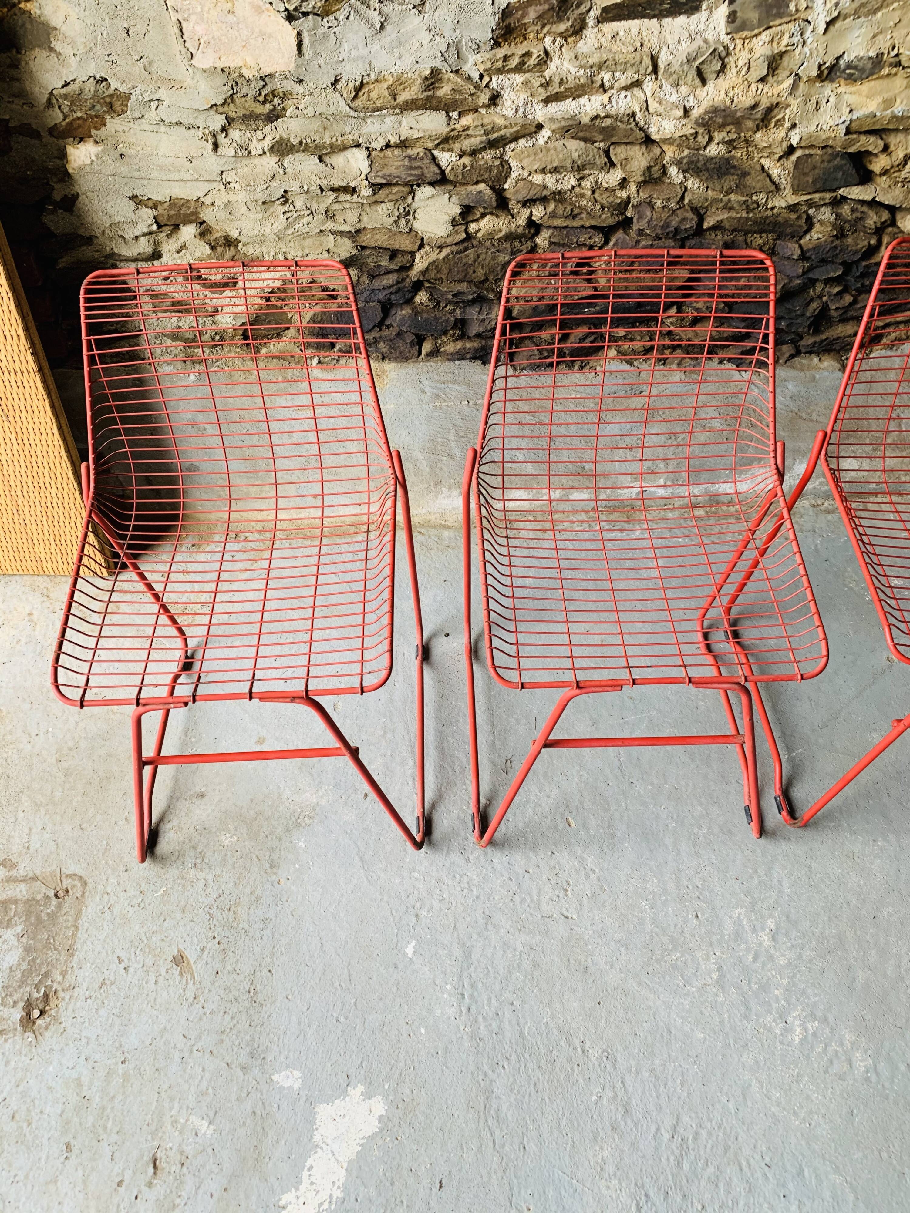 4 red design chairs