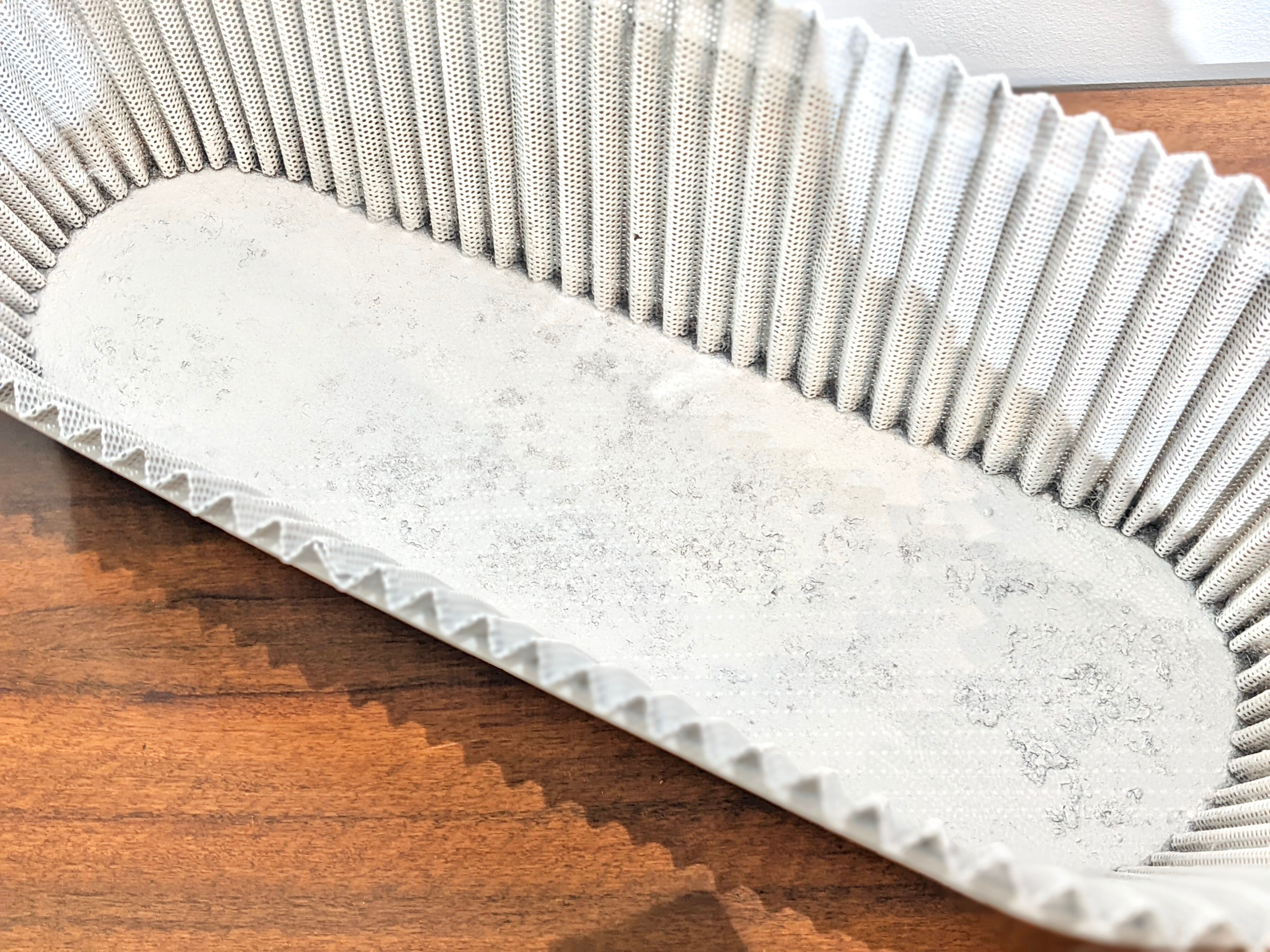 White perforated sheet metal planter by Mathieu Mategot