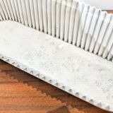 White perforated sheet metal planter by Mathieu Mategot