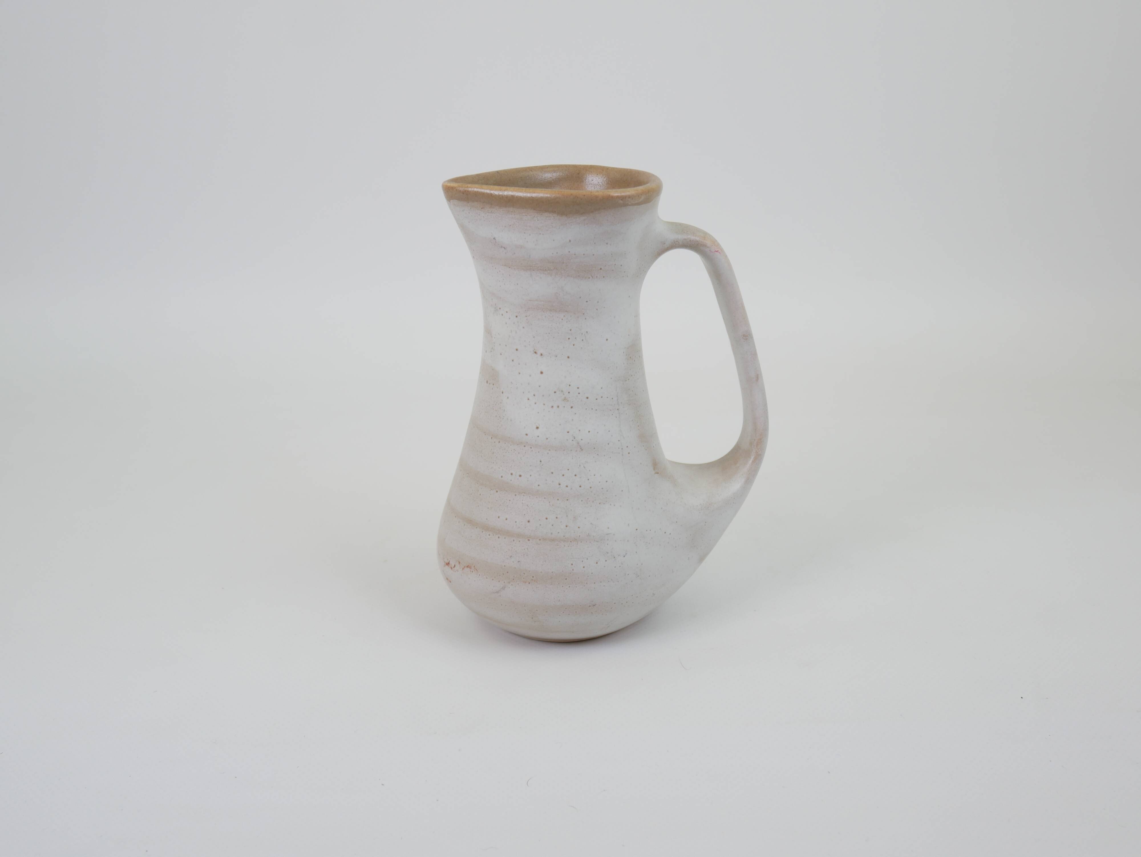 Signed white beige ceramic pitcher