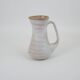 Signed white beige ceramic pitcher