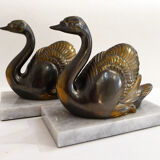 Swan bookends on marble