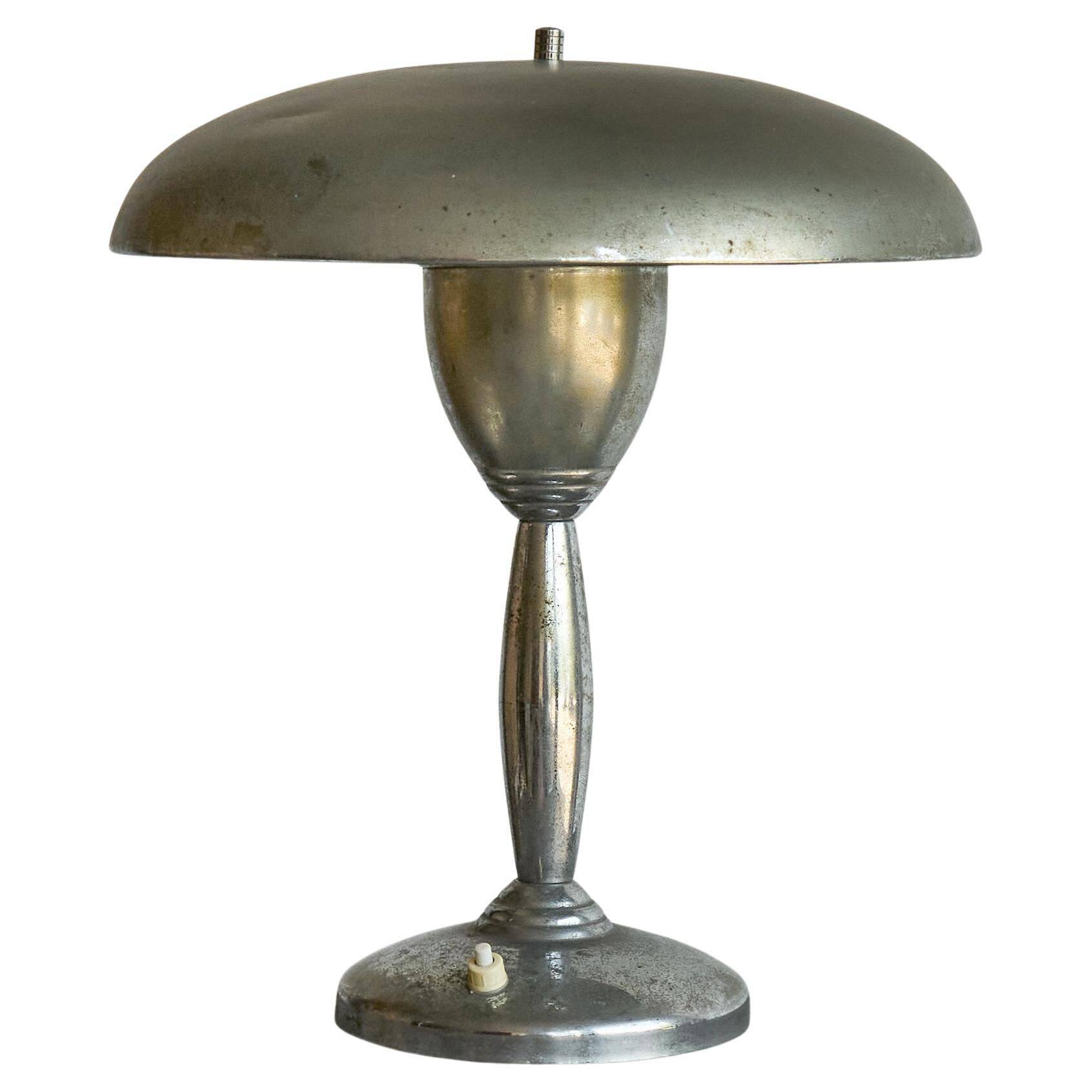 Patinated brass and chrome table lamp from the 1950s.