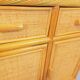 Vintage storage unit in rattan and woven rattan from the 1970s.