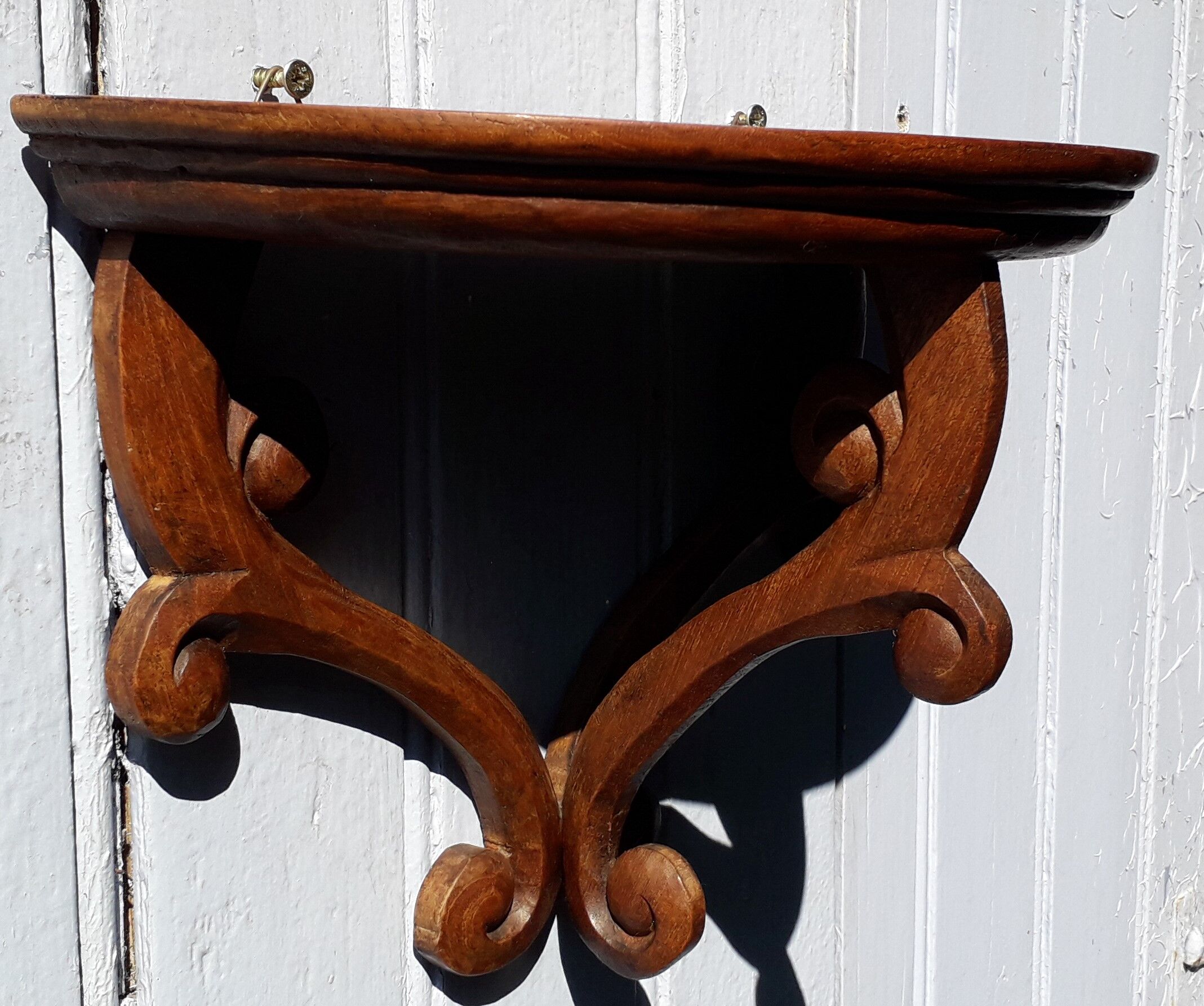 Carved wooden console shelf