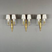 Set of three Louis XVI style wall sconces in gilded bronze, 20th century.