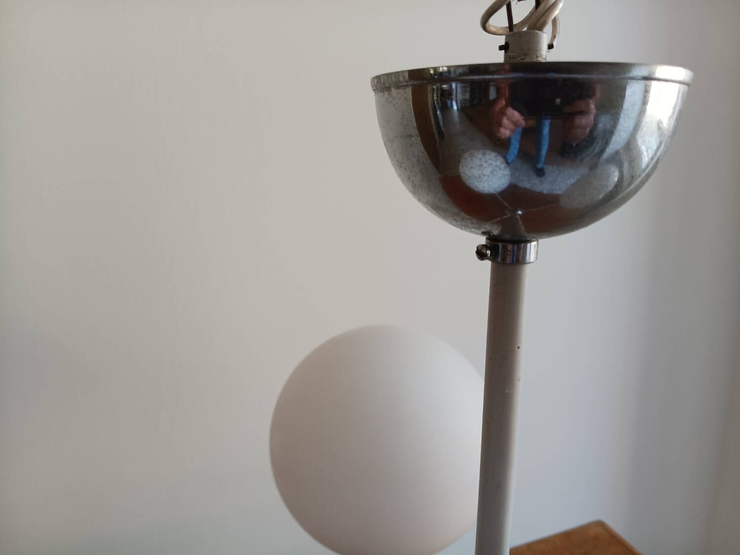 White ball and metal chandelier