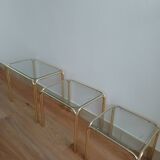 Glass and gold nesting table from the 70s