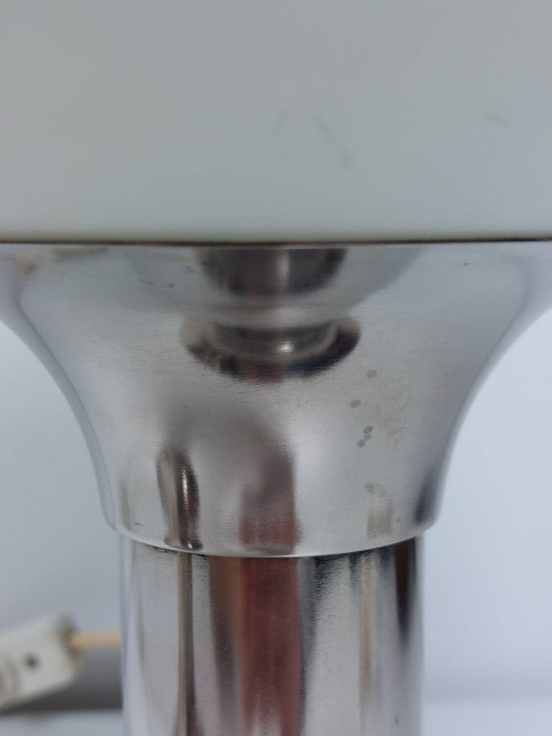 Pair of vintage futuristic style table lamps in chrome and opal glass.