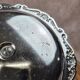 Small vintage round display stand in chrome metal – rococo style