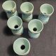 Antique painted wooden egg cups, set of six from the 1930s.