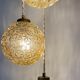 Suspension cascade trois feux globes vintage en verre ambré