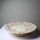 Short antique Longchamp stand with polychrome daisies in earthenware.
