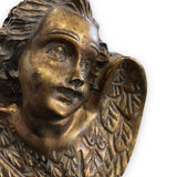 Pair of angel head wall sconces in gilded composition