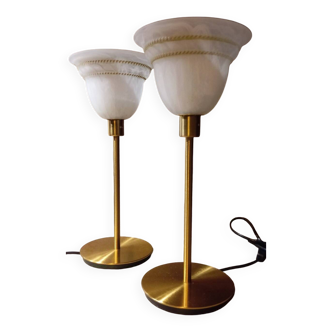 Duo of retro chic bedside lamps in gold metal, draped white globes