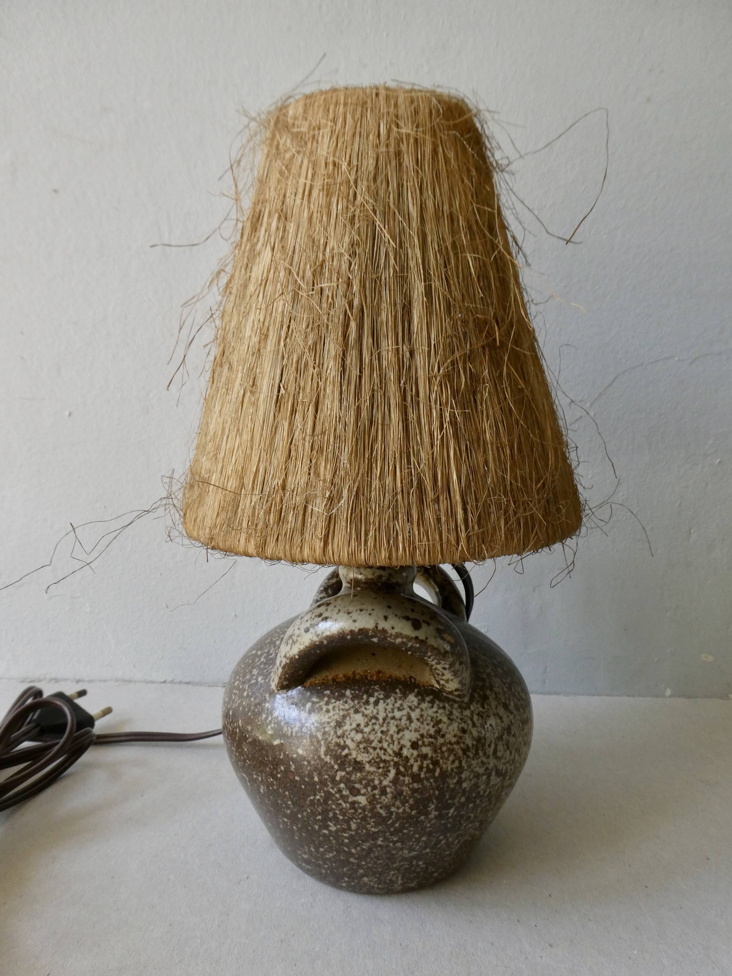 Sandstone lamp with natural fiber lampshade