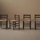 Set of four wooden and straw chairs, around 1960.
