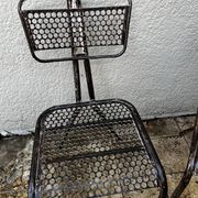 Pairs of perforated metal chairs by René Malaval