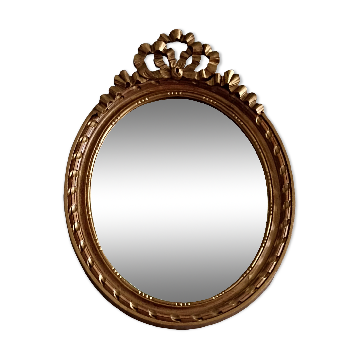 Oval mirror in carved and gilded wood in Louis XVI style