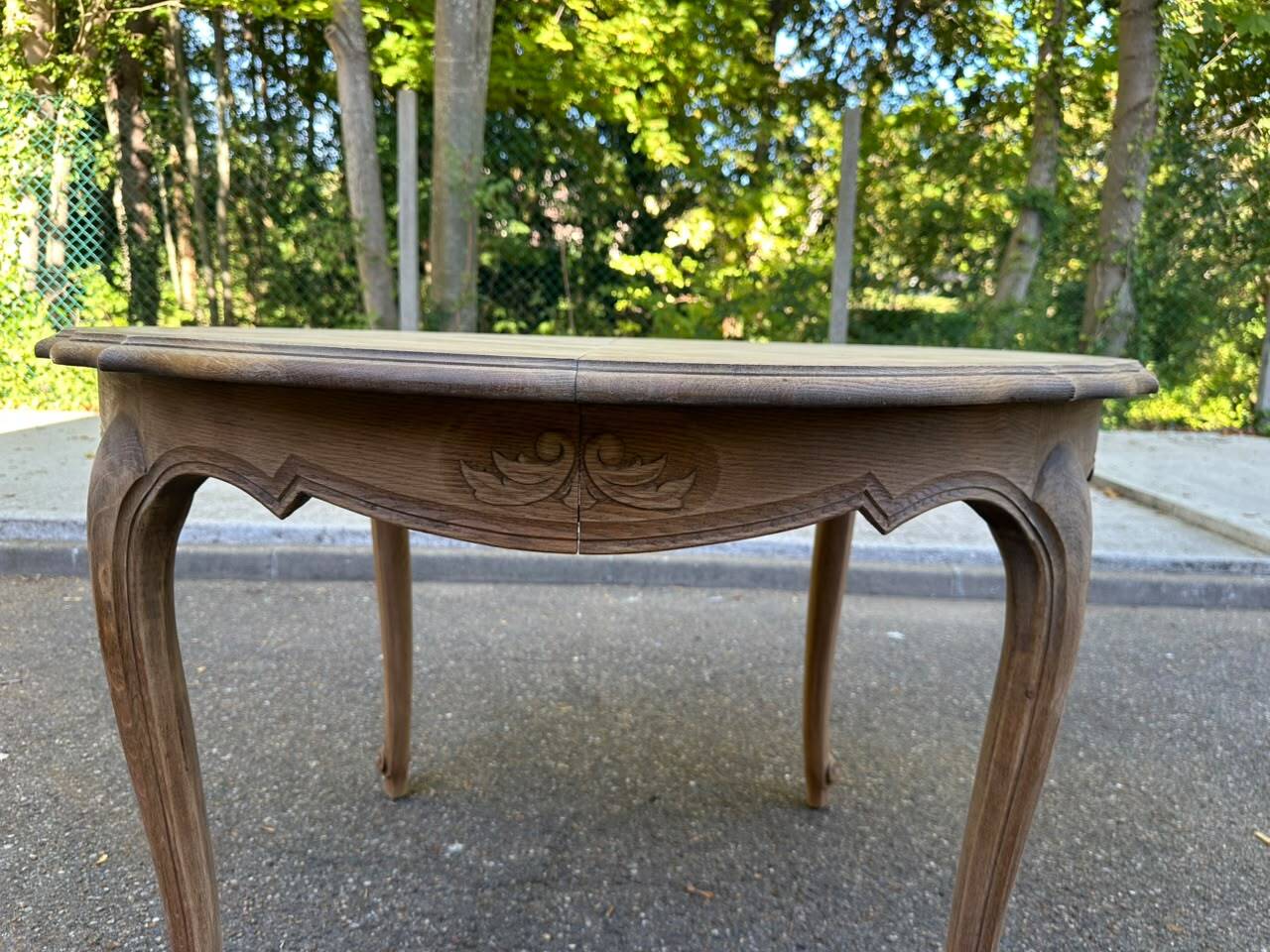 Round extendable dining table Louis XV stripped in solid oak 1950