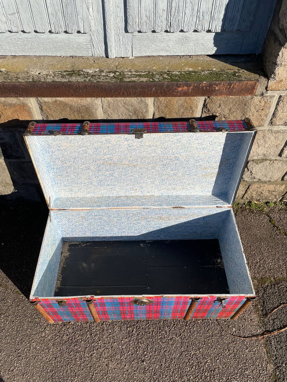 Old wooden and metal travel trunk