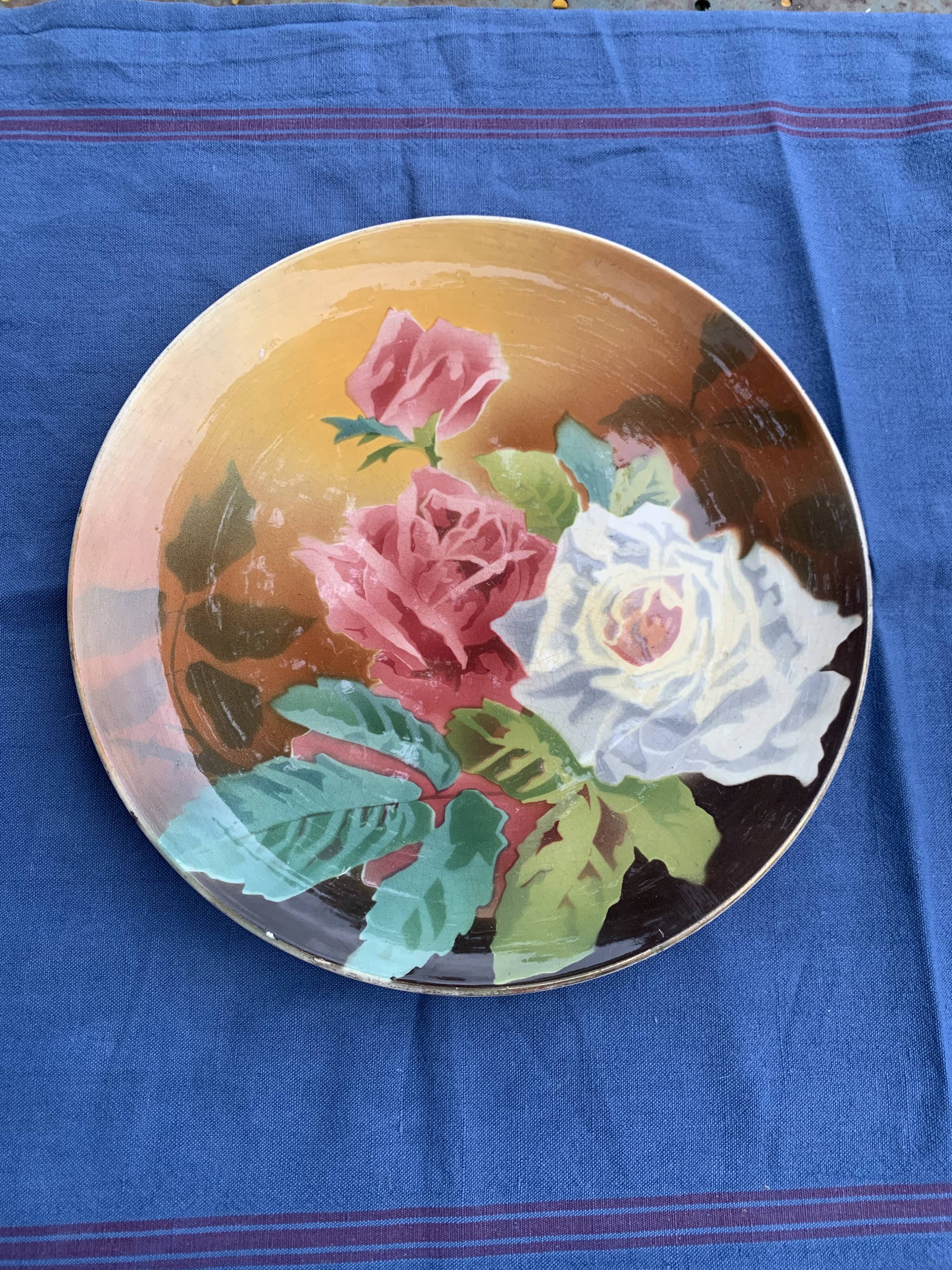 Plate with iron rose motifs, hb, Choisy le roi art deco