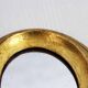 Golden oval mirror