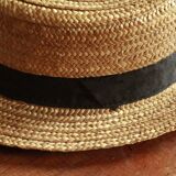 Old straw hat with black ribbon