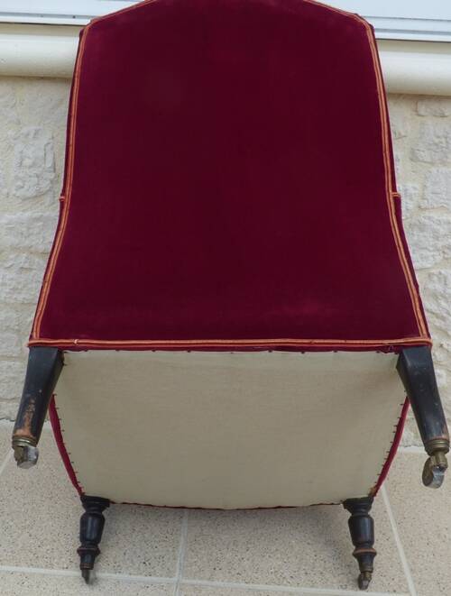 Bergère with blackened wooden legs on casters, Napoleon III period, velvet upholstery