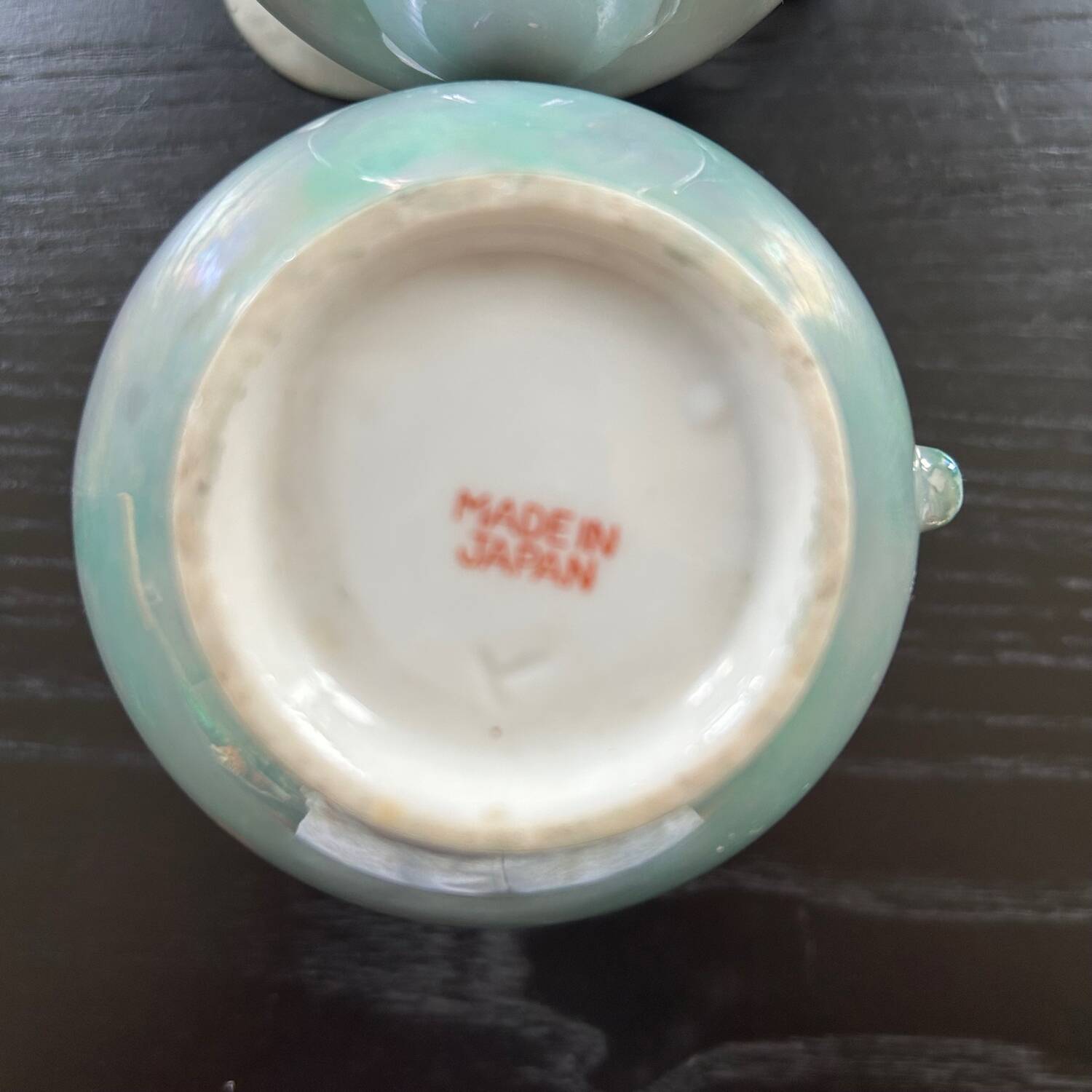 Pair of iridescent blue pitchers