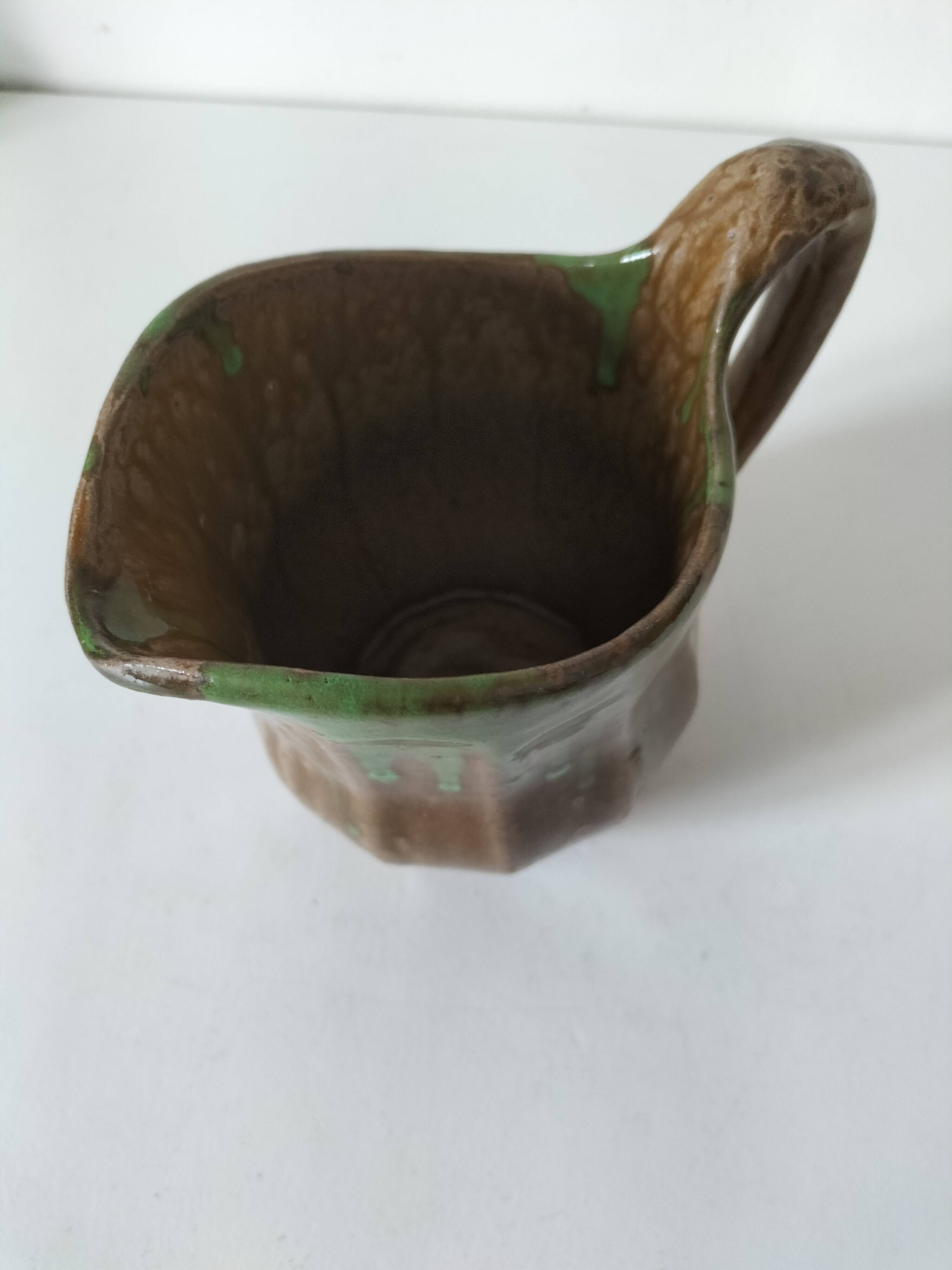 Handcrafted green and brown glazed ceramic pitcher, 1960s-70s