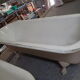 Cast iron island bathtub, on eagle-begged feet
