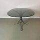 Vintage coffee table from the 70s in smoked glass and chrome, oval, Space Age style.