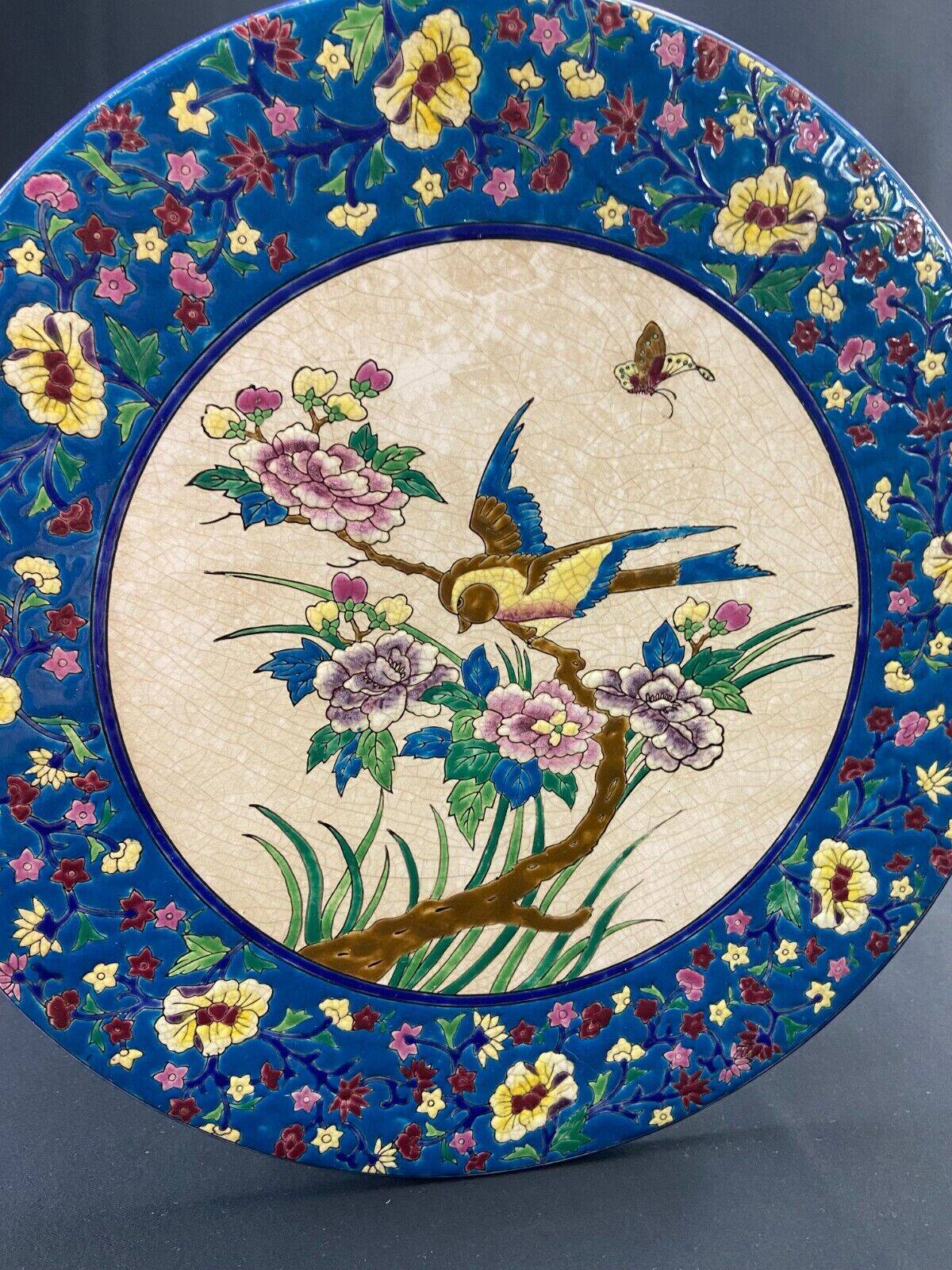 Large circular earthenware dish from Louvière with Longwy style bird decoration