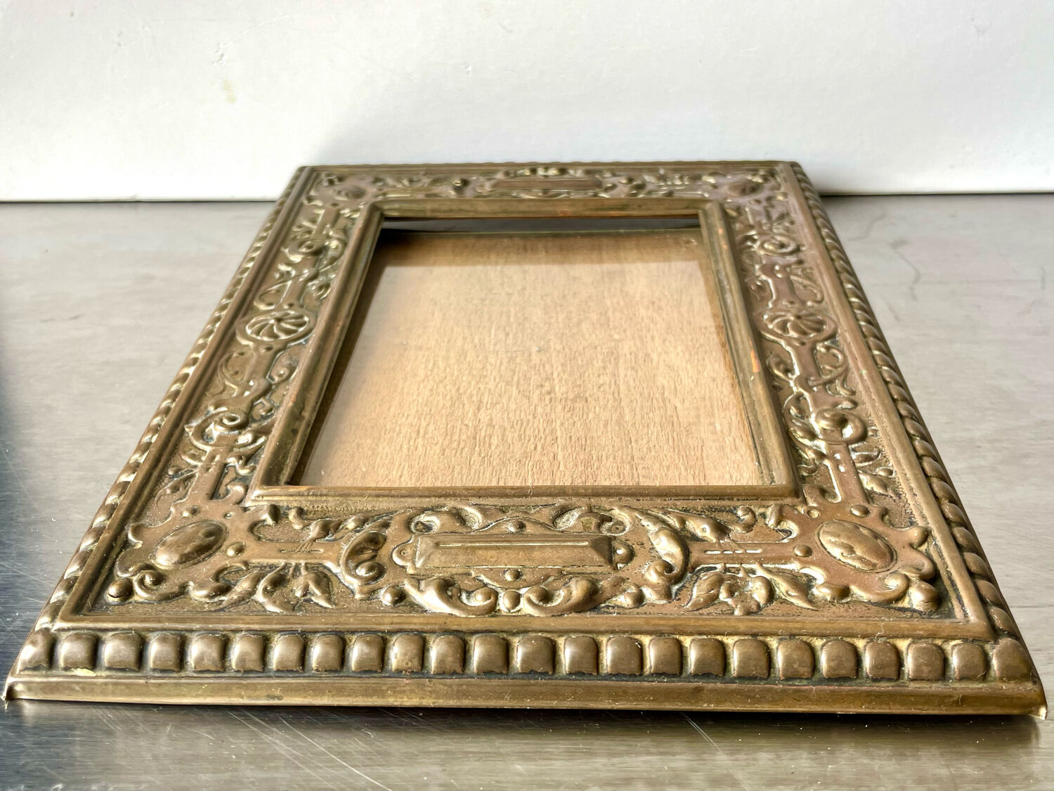 Antique brass metal picture frame in baroque style