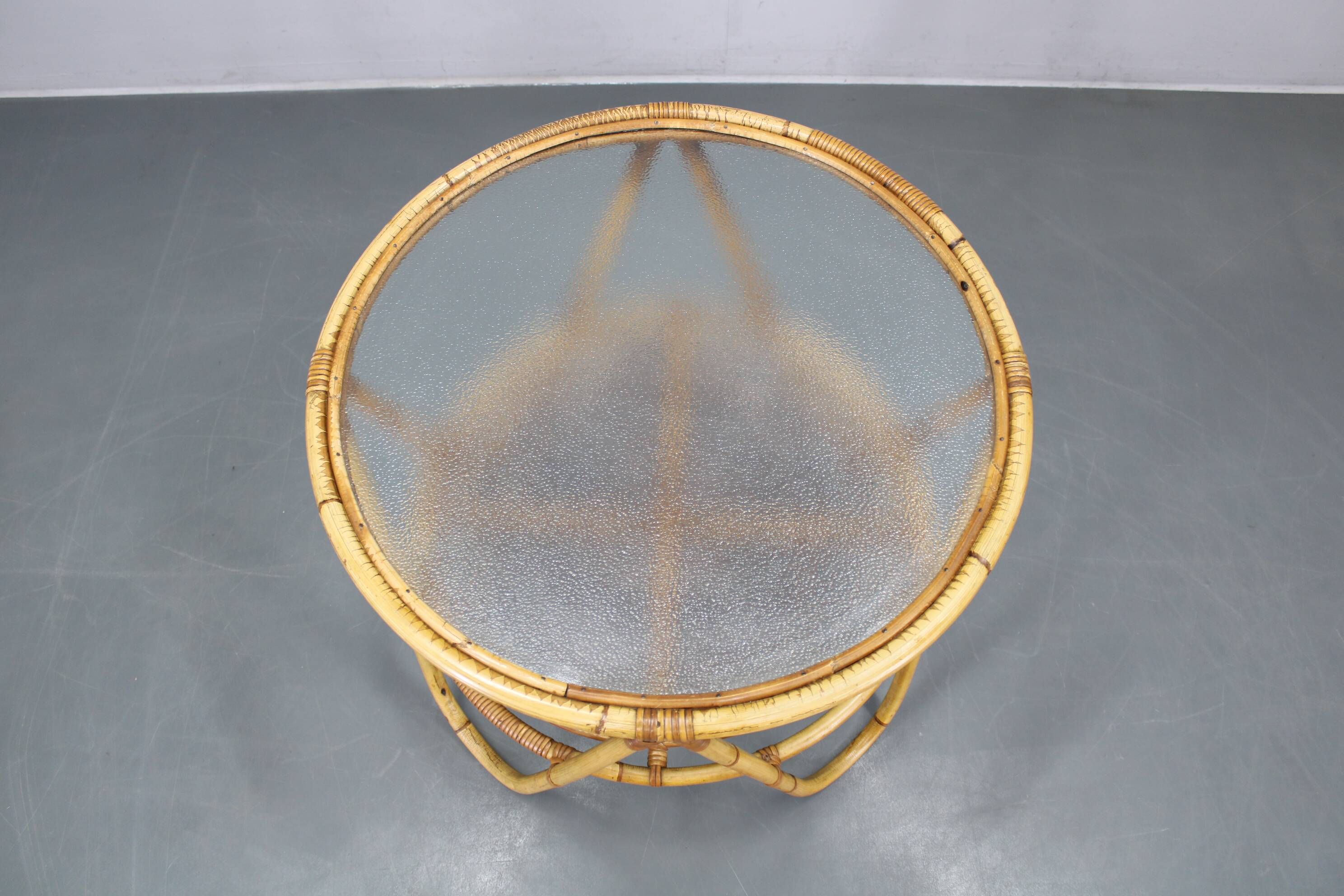 1960s Italian rattan coffee table with glass top, mid-century round design