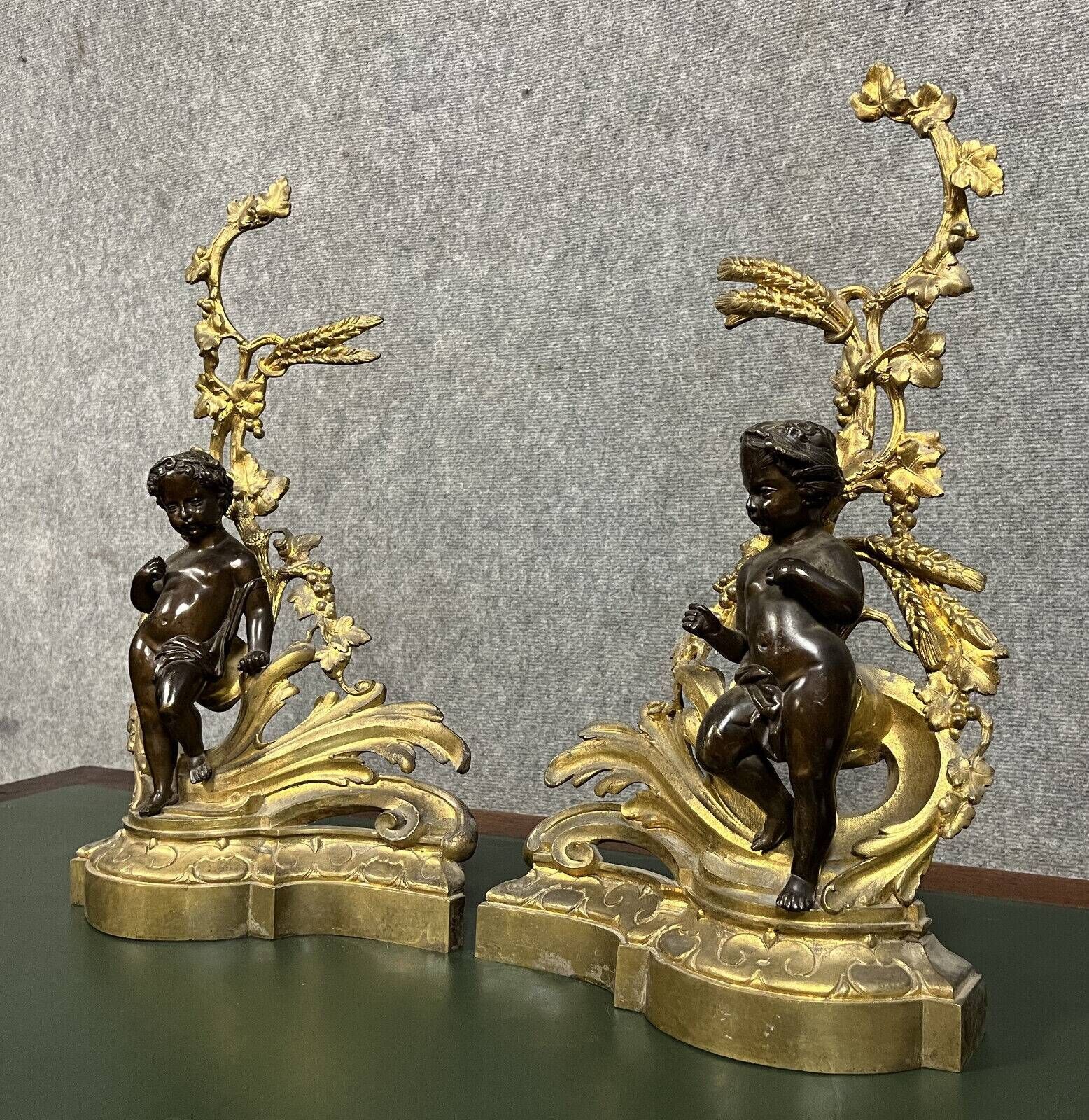 Pair of gilded bronze and patinated bronze andirons depicting putti circa 1850