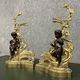 Pair of gilded bronze and patinated bronze andirons depicting putti circa 1850