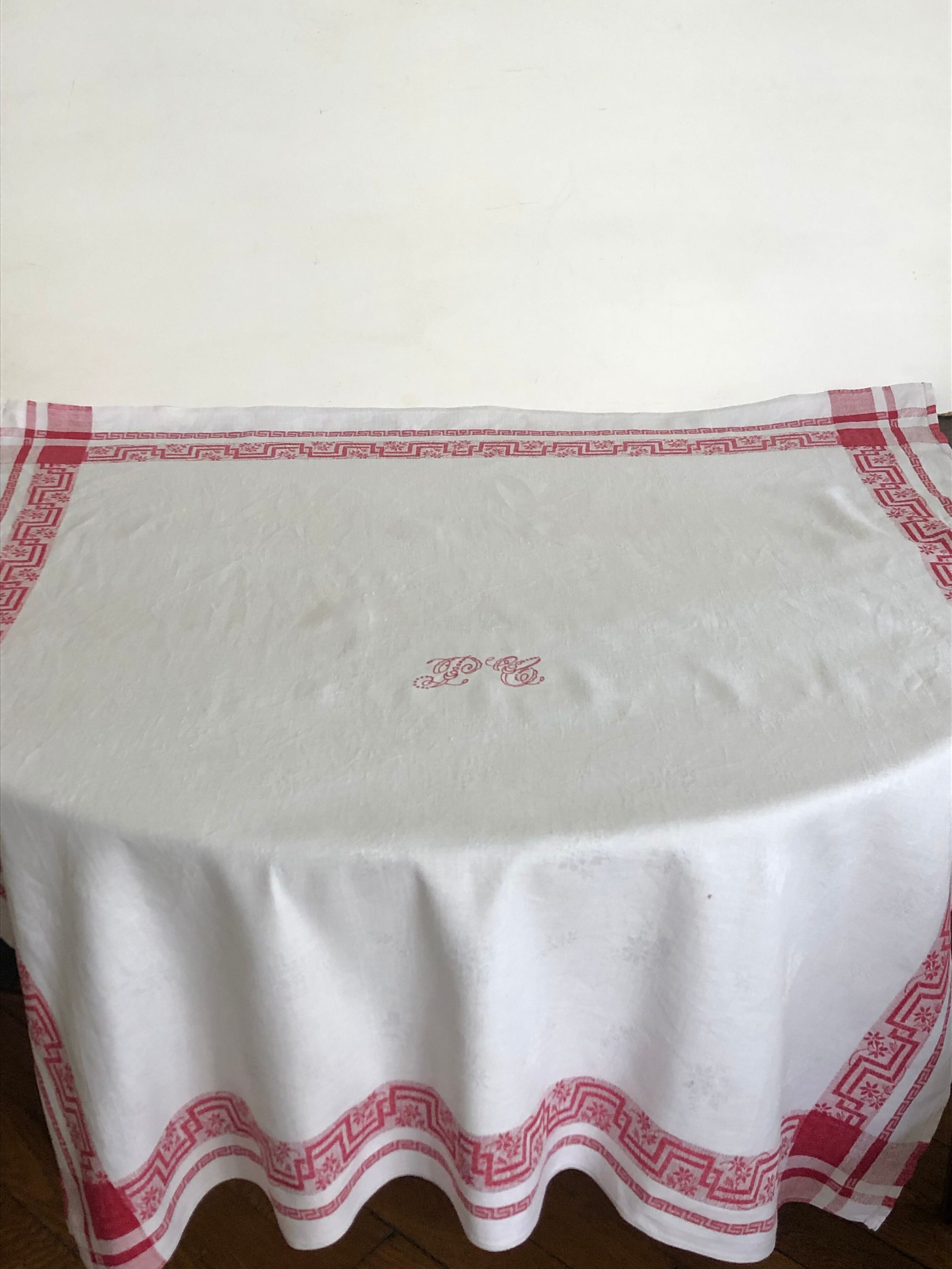 Ancient damask tablecloth with monogram