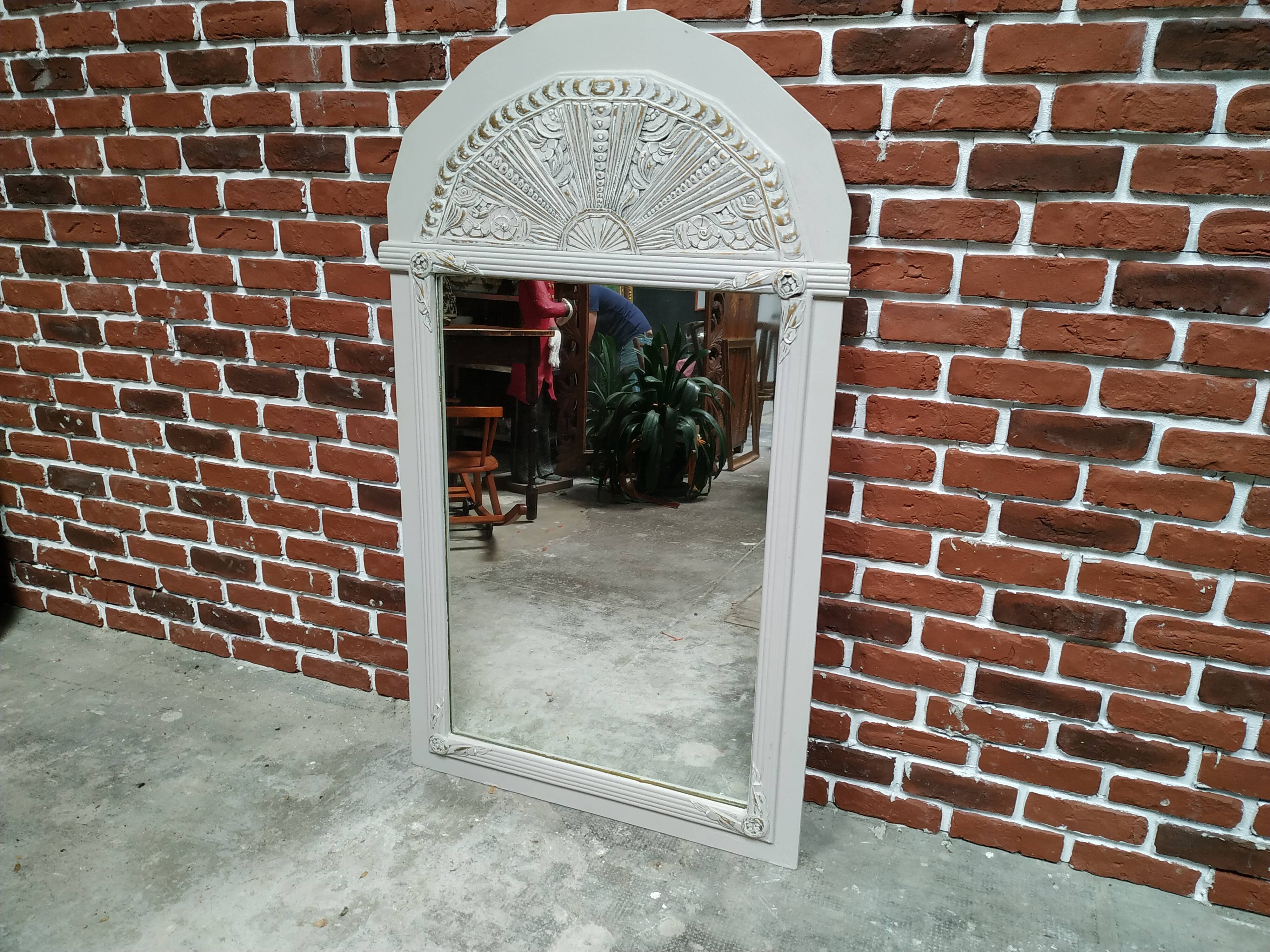 White and gold patinated sculpted mirror