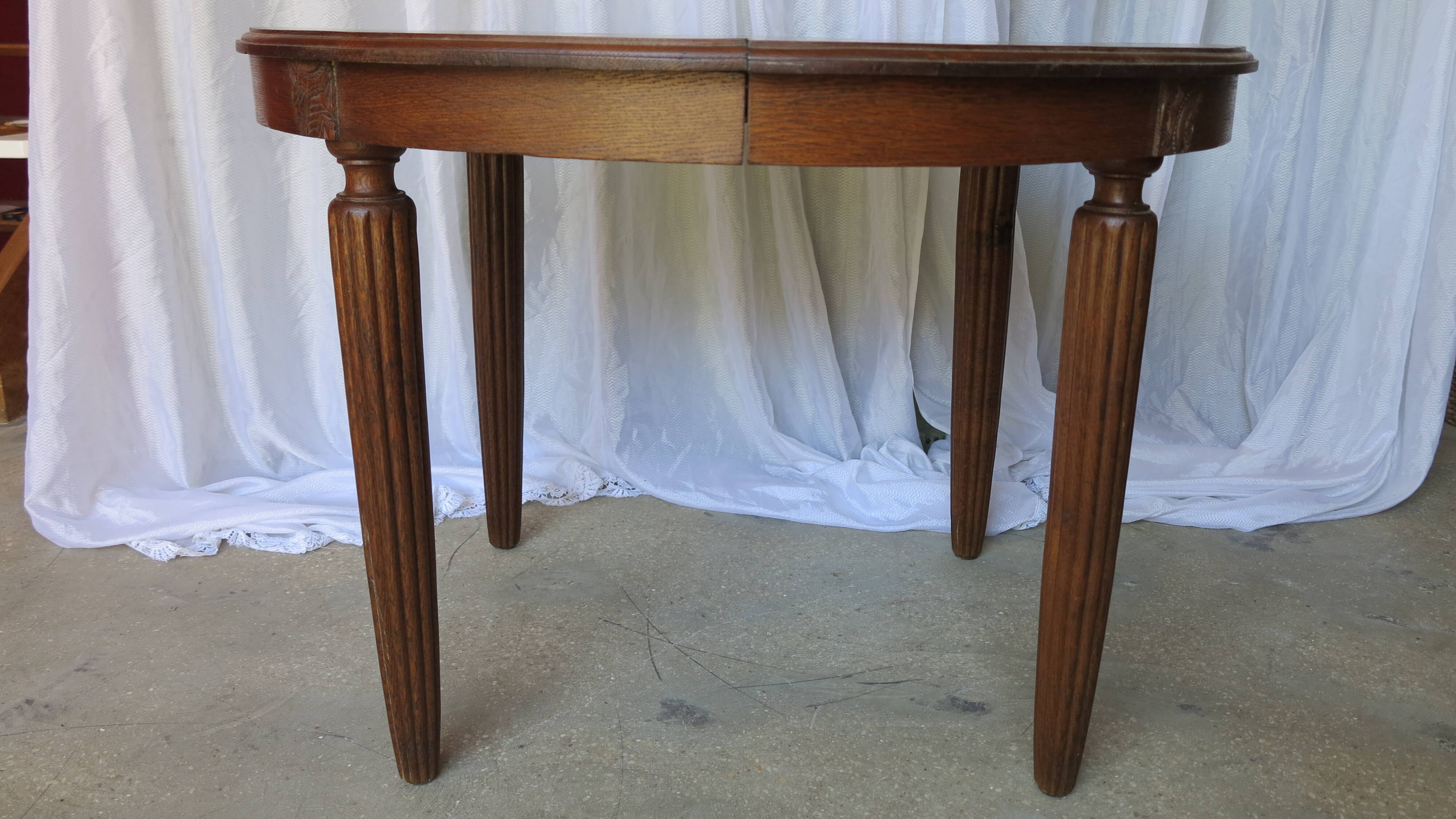 1930s oak dining table, slightly oval.